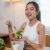 young-asian-sportswoman-eating-healthy-salad-at-ho-2025-04-27-10-38-28-utc-e1752636321429.jpeg